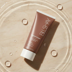 Tube of BLSAN Night Cream on a beige surface with water droplets